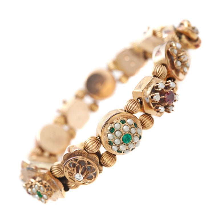 Antique Precious Gemstone, Semi-Precious Gemstone & Yellow Gold Slide Bracelet<br />
12 slides: (starting from top to bottom)<br />
1) Natural Pearls<br />
2) Diamond<br />
3) Seed Pearls<br />
4) Spessartite Garnet & Seed Pearls<br />
5)