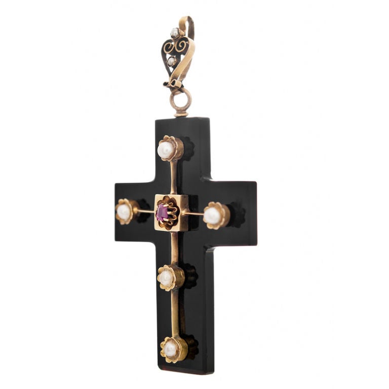 A extremely unique Victorian cross, boasting a carved onyx base with ruby and natural pearls set in 18k yellow gold. <br />
-Original Box