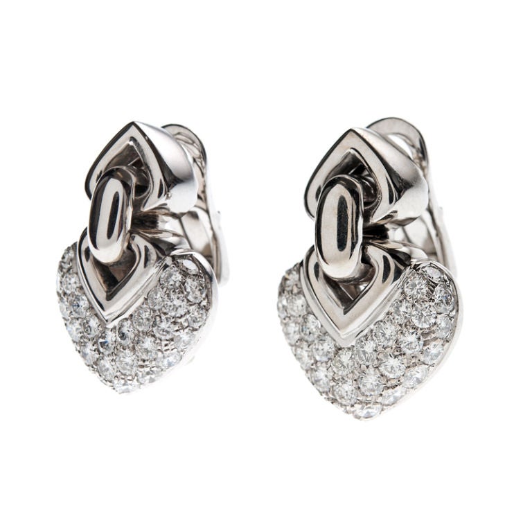 A lovely pair of 18k white gold and diamond heart-shaped earrings by BULGARI. Designed to be 