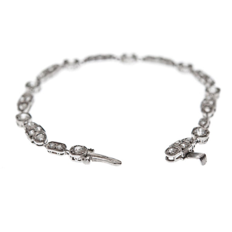 Art Deco Elegant Diamond and Platinum Unique Tennis Bracelet at 1stDibs