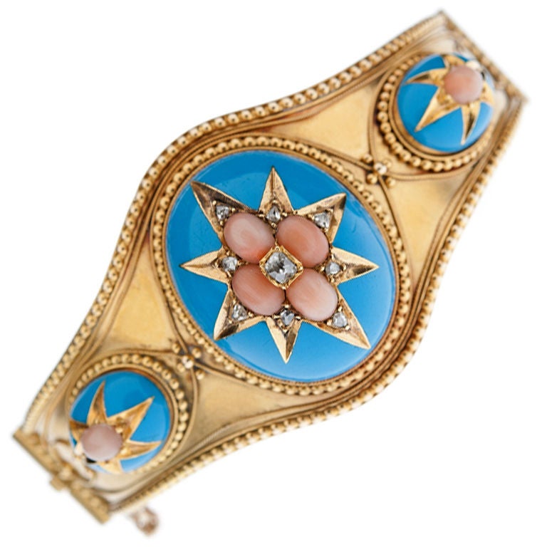 A fantastic example of a piece of very fine Victorian jewelry, beautifully designed and masterfully executed. The fine angel skin coral and pristine turquoise enamel looks incredible together on yellow gold, interjected with accenting diamonds to