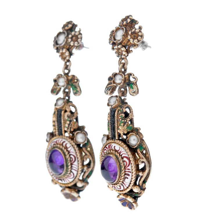 Striking and unusual Austro-Hungarian long drop earrings. Beautifully handmade in gold over silver, these earrings are the trifecta: Fine make, one-of-a-kind design, and they look gorgeous in their own unique way. In addition fine Amethyst highlight