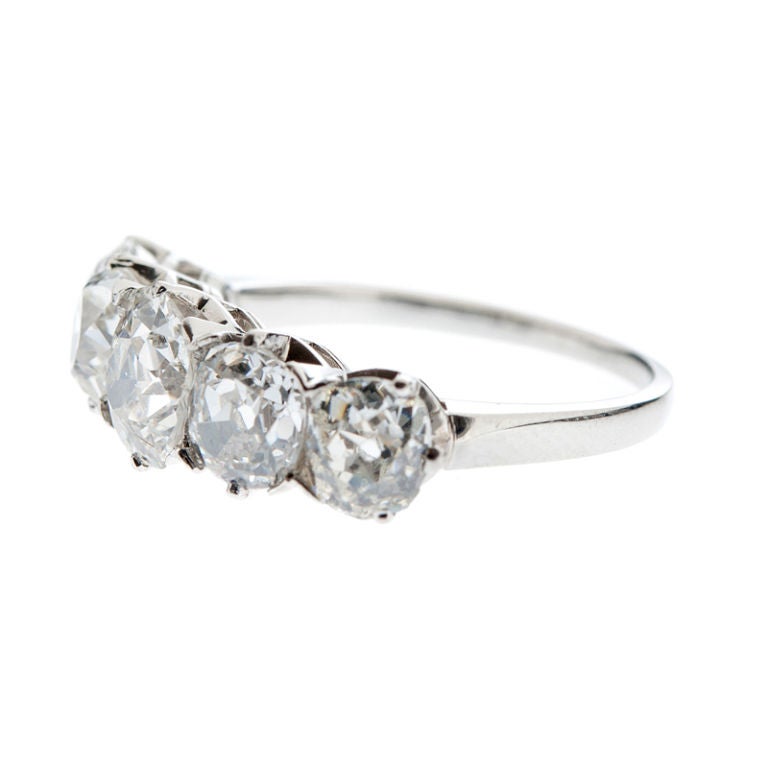 Gorgeous original Art Deco Five-Stone diamond & platinum handmade ring from the early deco period of the 1920's. Victorian in motif, this five-stone is an adaptation of the classic three-stone diamond engagement ring, this one, however, made in