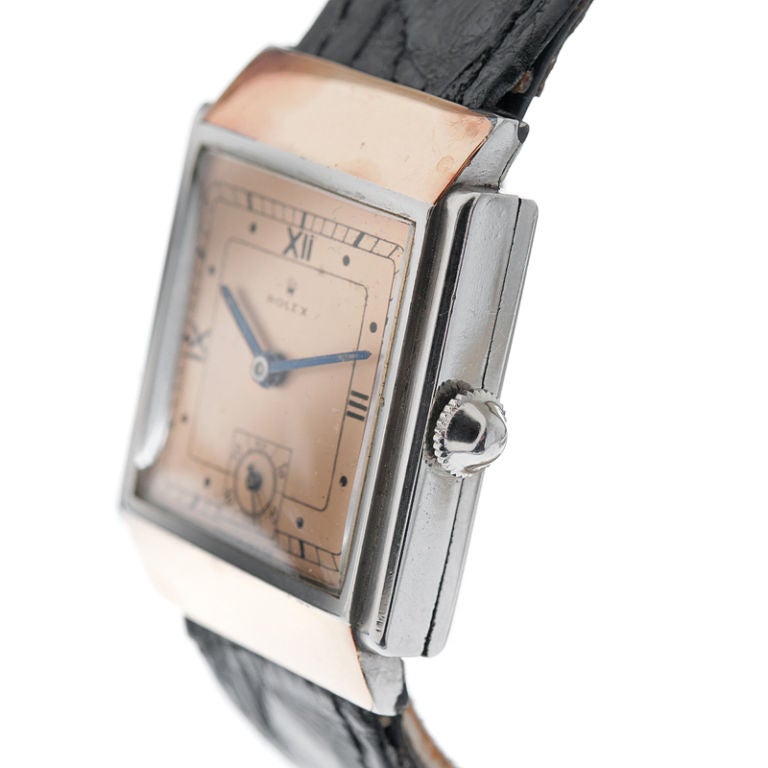 Lovely 1930s stainless steel and rose gold rectangular watch with hooded lugs and a sub-seconds dial. This would have originally been a gentleman's watch, however, it is probably more ideally suited for a lady, considering its modest