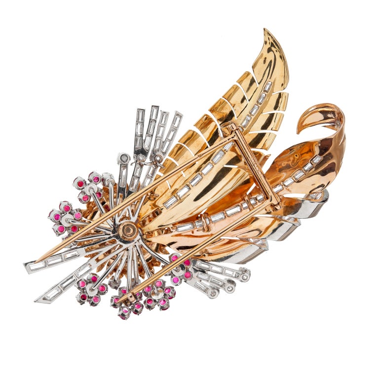Impressive in scale and craftsmanship this signed pin has incredible detail. Beautiful feather and flower motif uses 3.60 carats of diamonds and 30 sumptuous rubies against rose gold and platinum.