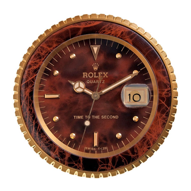 The ideal accessory for the Rolex enthusiast in your life! Measuring 4.75 inches in diameter, this handsome and very heavy clock will make a substantial addition to your collection of Rolex memorabilia. This is a rare example, with an elegant