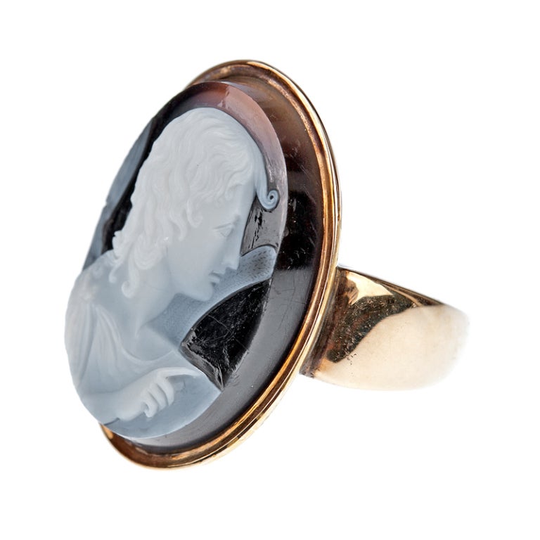 Finely detailed, high relief agate cameo ring shows the Greek inspired imagery of a woman's soft and knowing gaze.