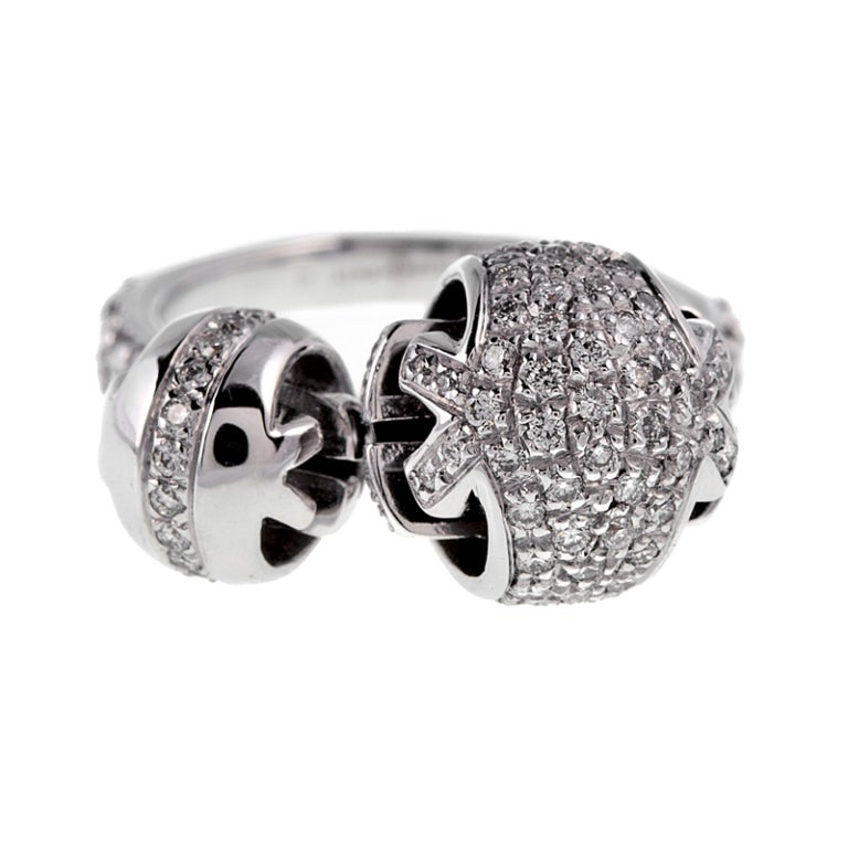 A fun and fashionable Gucci ring, made in 18k white gold with 1.13 carats of G color VVS clarity diamonds. Attached to the shank are the major design components of this ring, two white gold diamond encrusted balls. Each ball is allowed movement,