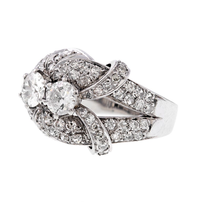 platinum
2 diamond weighing 1.15ct, with an additional 1.05 carats of diamonds throughout the setting.