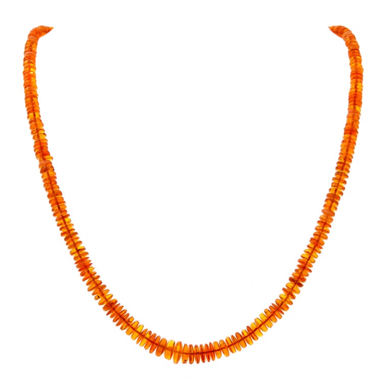 Blazing Mexican Fire Opals radiate warmth in this strand of incredible stones that is finished off with an intricate white gold and diamond Art Deco Clasp.