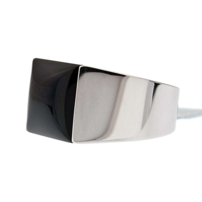 Streamlined and sharp, a wonderful ring by Cartier. Made in 18K white gold with Onyx center.