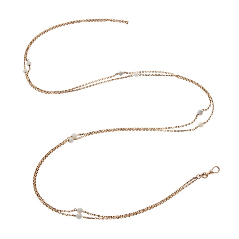Absolutely feminine and elegantly adorned with 10- 5mm opal spheres, this 14K rose gold chain is 60