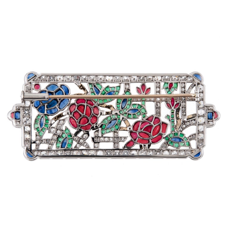 One of the finest examples of skilled art deco era hand craftsmanship to grace our presence… The labor that it took to create this highly detailed masterpiece is immense. Each colored gemstone is custom cut to fit in its perfect place to create the