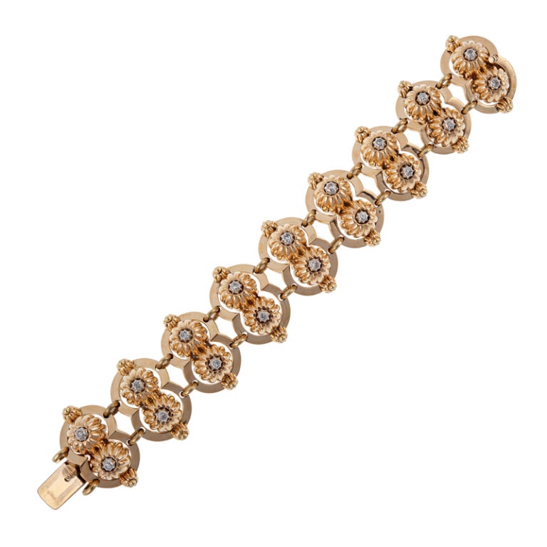 Inspired both in design and execution, this substantial bracelet has a sophisticated, yet organic feeling. Each section is connected with golden jump rings to allow for movement and is comprised of opposing half circles, joined on the sides in what