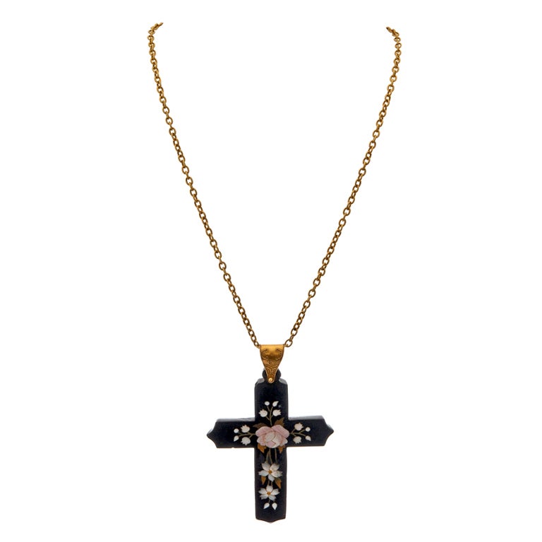 Dramatic in size, yet sweet in nature, this fine pietra dura cross is an absolute article of beauty, as well as a fashion statement. Measuring an assertive three inches in height (including the bale), the size is tempered by the soft floral motif.