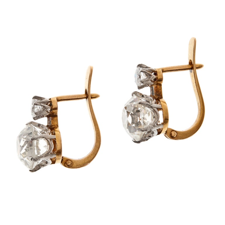 The ideal alternative to diamond studs... These earrings are every bit as wearable, versatile and classic, without being ordinary. Two pairs of ideally matched old European cut diamonds, the smaller stacked atop the larger, weigh 3.58 carats in