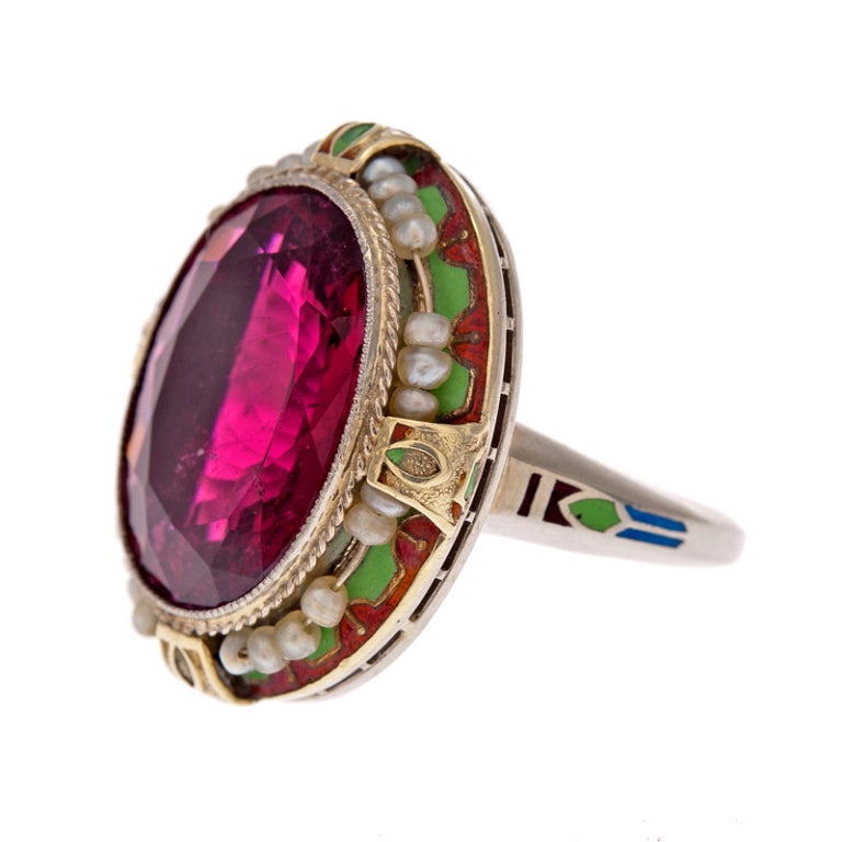 Brace yourself... The rubellite at the center of this ring is absolutely dazzling, with brilliance, intensity and mesmerizing color! The combination of the 8.70 carat center and the spectacularly detailed mounting is noteworthy and embodies the