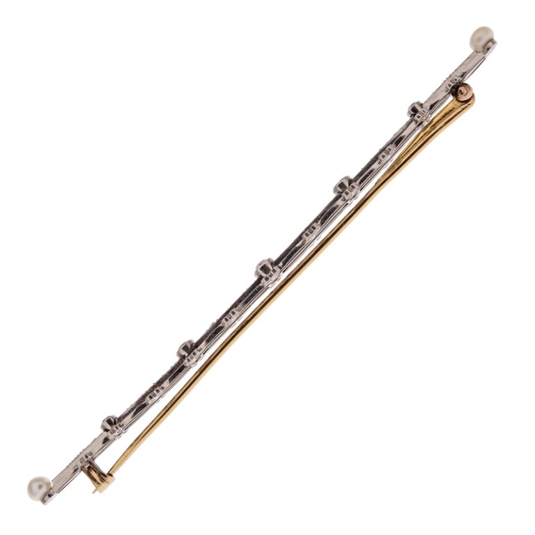 Extra long Edwardian bar pin, celebrating the best design elements of the era. At an impressive 3 5/8 inches long, this piece makes a statement beyond the elegant feminine nature that Edwardian jewelry is known for. 

Five old European cut