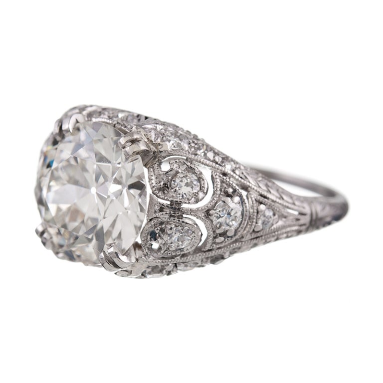 A brilliant 2.42 carat I color VS1 clarity old european cut diamond highlights this fine 1930's ring. The setting is meticulously hand pierced with excellent symmetry, a wonderful example of Art Deco design and craftsmanship. The ring has been kept