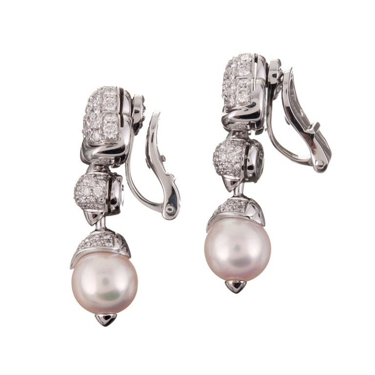 Bulgari Diamond, Pearl & White Gold Earrings. Shimmering Diamonds Enhance beautiful Pearl Drop Earrings as only Bulgari can! The earrings measure approximately 1-1/4 of an inch in total length. A gorgeous pair of classic Bulgari earrings that will