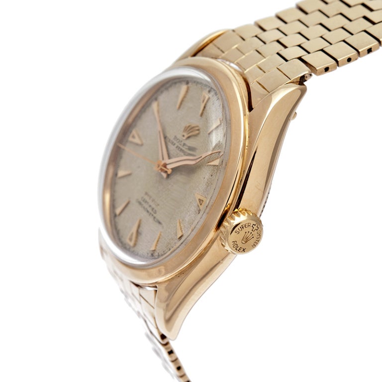 Rare Rolex Oyster Perpetual, Ref. 6084, fitted with a gorgeous ivory-colored honeycomb dial and 