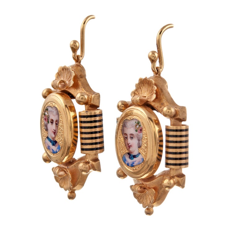 Extremely fine rendition of Victorian jewelry, with detailed miniature portraits of enamel in an ornate frame. The closer you look, the more details come to the surface- these are truly an antique, wearable work of art!