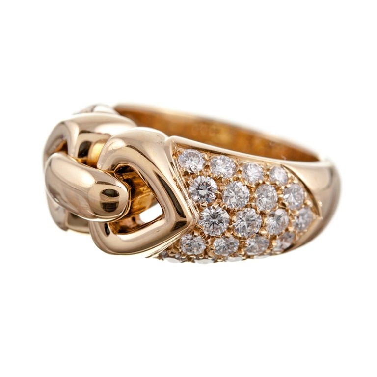 A lovely Bulgari piece, accomplished in design and detail, yet suitable for every day wear. The ring is designed as a polished golden knot, surrounded by brilliant white diamonds which weigh 1.38 carats. It has a sophisticated overall look, yet a