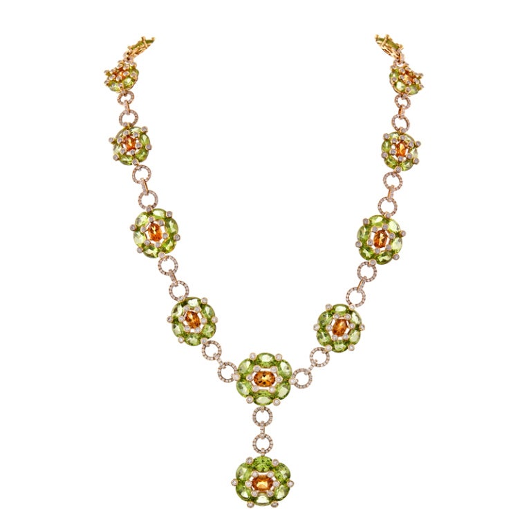 Handmade Peridot, Citrine & Diamond Cluster Style Suite:

Necklace: 11.28 carats Diamond, 72.87 carats fine Peridot, 8.17 carats fine Citrine. The necklace measures 17-1/2 inches in length with the center drop (including the three