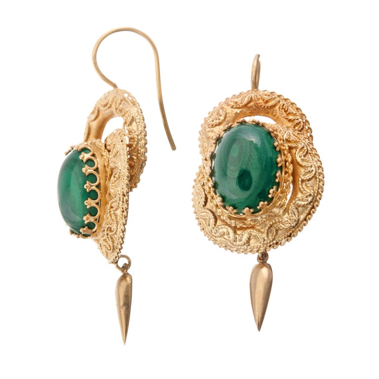 These beautiful gold earrings are finely detailed with granulation, twisted rope detail and exquisite wire work. The rich color combination of green malachite and warm yellow gold make these earrings a striking stand out.
