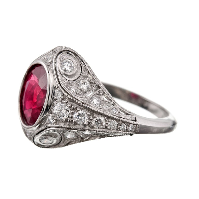 Inspired by the fine and distinctive detail of the art deco period, Parisian jewelry designer Sebastien Barier creates handmade fine jewelry in small quantities, so each piece is truly special. This ring contains a vibrant oval ruby of 2.05 carats