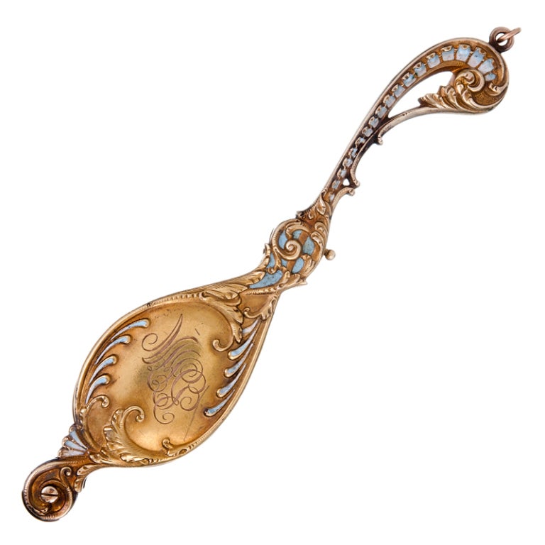 The lorgnette: An elongated piece of jeweler, worn around the neck as a pendant, yet concealing a pair of reading or opera glasses; a beautiful bauble which represents with grace and enthusiasm the distinctive charms of art nouveau design. Forged in