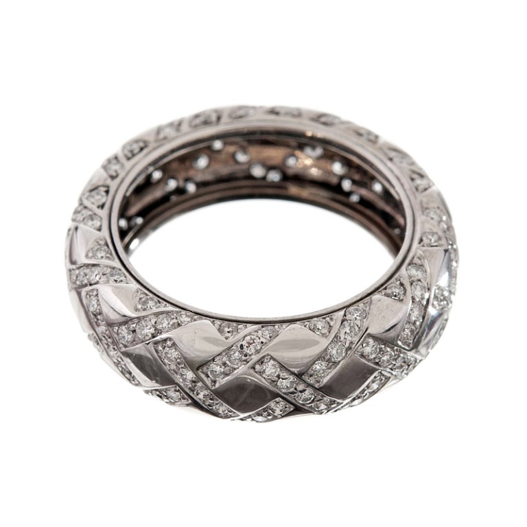 A latticework of brilliant white diamonds adorns this ring in never-endng circumference. The ring has approximately 1.0 carat of diamonds and is currently a size 6. It could be modestly resized a bit smaller or larger. It has a nice three-dmensional
