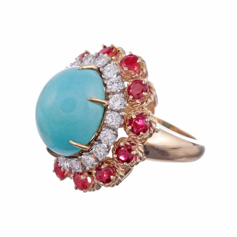 A bold display of color, with a nod to Americana: this is a whole new pop of red, white and blue. A large cabochon turquoise, framed in a bull's eye of rubies and diamonds. In total 1.60 carats of rubies and 1.10 carats of diamonds compliment this