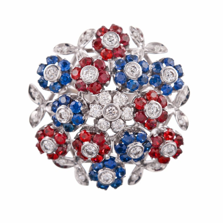 Charming bouquets of gemstone-set flowers, fashioned into wearable splendor. Each sapphire- and diamond flower is set to allow for gentle, subtle movement. This 