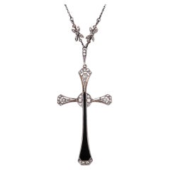 Large Edwardian Diamond and Onyx Cross on Floral Diamond Chain