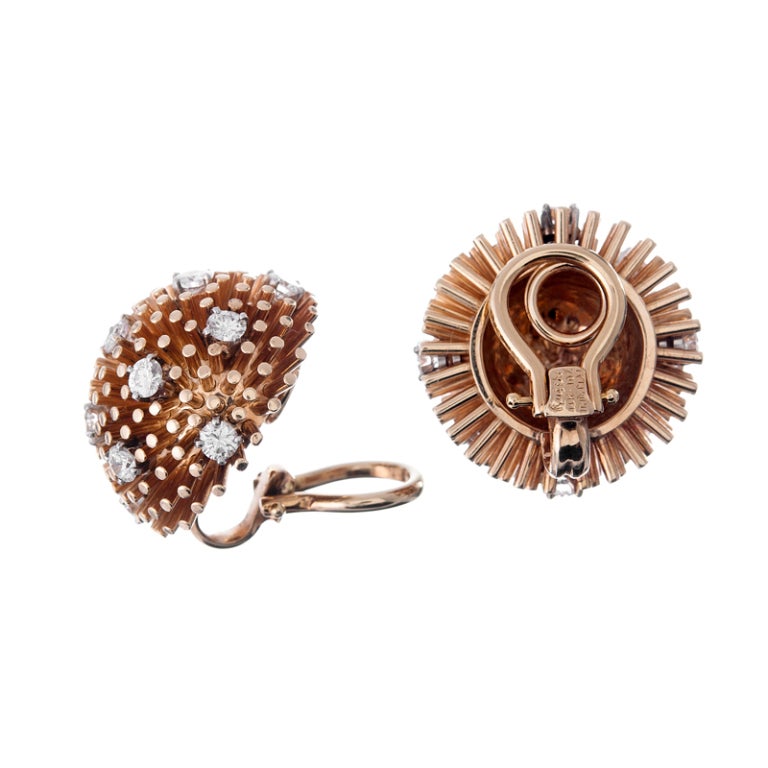 Sophisticated space age: 14k rose gold earrings, half sphere with golden rods bursting from the epicenter and decorated with approximately 3 carats of round diamonds. Currently clips, but can easily be converted to pierced with posts and omega backs