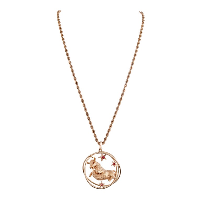 A fun piece in 14k yellow gold: William Ruser, celebrated American jeweler and creator of many a retro treasure, offered a whole program of wearable art inspired by the signs of the Zodiac. This piece, a lifelike bull contained in three golden