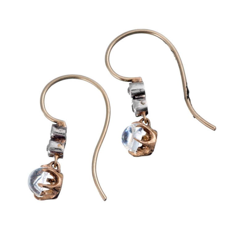 Sweet, petite and feminine diamond and moonstone drop earrings... the perfect gift for the budding, young antique jewelry enthusiast or for someone who prefers a modest finery. These lovely little earrings measure just 7/8 of an inch in overall