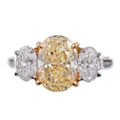2.54Ct Fancy Yellow Diamond and White Diamond Three Stone Ring