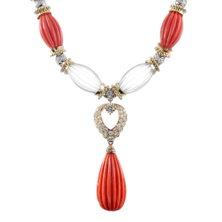 With the sophisticated appeal of icons like David Webb, but without the price tag of a signed piece, this necklace would be a worthy addition to the most discerning of lady's jewel boxes. Mystical rock crystal and vibrant coral, separated by golden