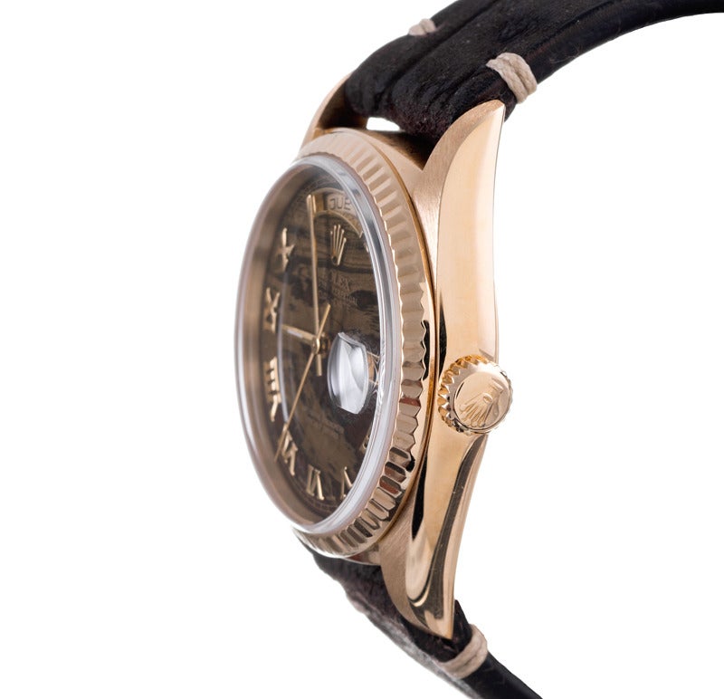 Double quick Day-Date, ref. #18238 with a very unusual stone dial and finished with Roman numeral markers. The dial is unlike any we have seen before and has a genuine organic quality, nearly looking as a swirl of golden brown granite and wood.