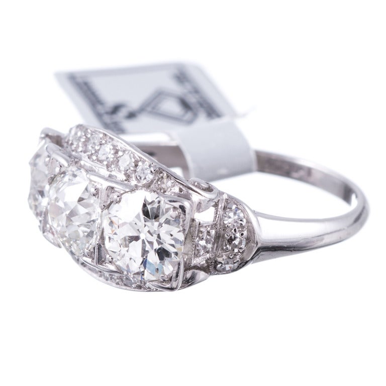 Three Old European Cut diamonds weighing 2.10 carats in total
-An additional twenty-two diamonds attribute 0.26 carats extra