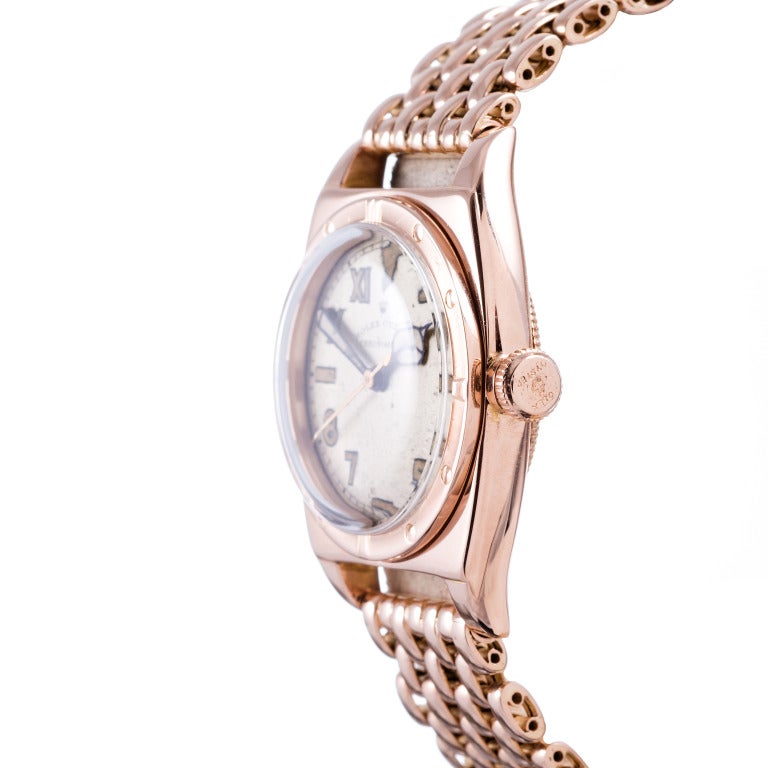 Unbelievably rare and handsome early example of a 1940s Rolex Viceroy in 18k rose gold. Manual wind, with a waterproof 32mm case and a striking original Rolex manufactured 