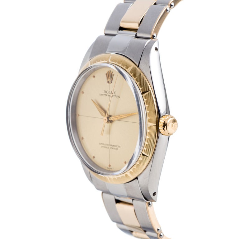 All original and in absolutely perfect vintage condition, this 14k yellow gold and stainless steel Rolex Zephyr offers a clean and sleek mid-century look with a sniper dial and no markers, just luminous. All the luminous dots are intact, the dial,