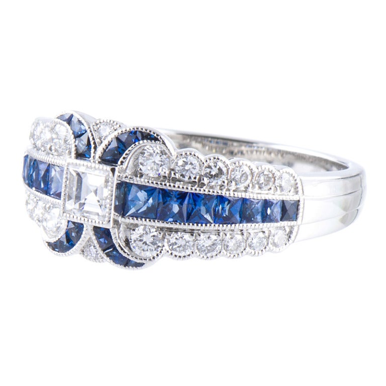 Immaculately detailed ring, conceived in the classic art deco style. Platinum, with approximately one carat of diamonds and one carat of sapphires. Lucie Campbell creates what are arguably the finest modern renderings of this celebrated era. Each