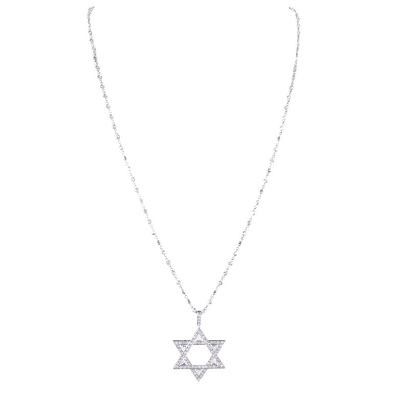 Very fine Star of David pendant, fitted with forty-eight diamonds weighing approximately 1 carat. This piece has been meticulously hand made, with no detail spared. It is presented on an 18 inch long platinum all old European cut 