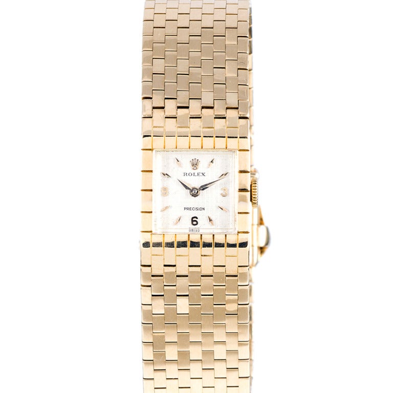 Rare, collectable, fashionable and elegant, this 18k yellow gold lady's bracelet watch is a special, wearable jewel. The piece boasts an original textured 