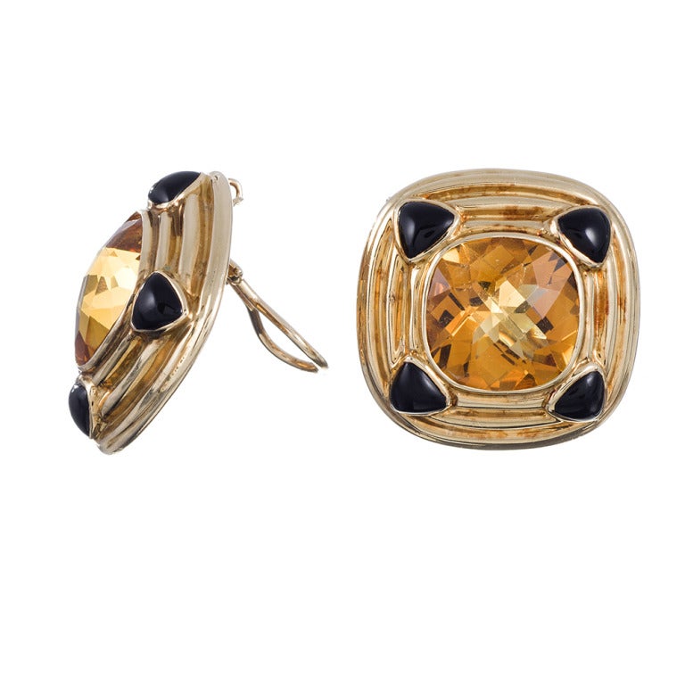 14k yellow gold ear clips measuring 1 1/8 inches from edge to edge. A bold combination of citrine and onyx, with architectural lines of polished gold. Make a sophisticated statement with a cocktail dress, crisp blouse or your favorite vintage piece.