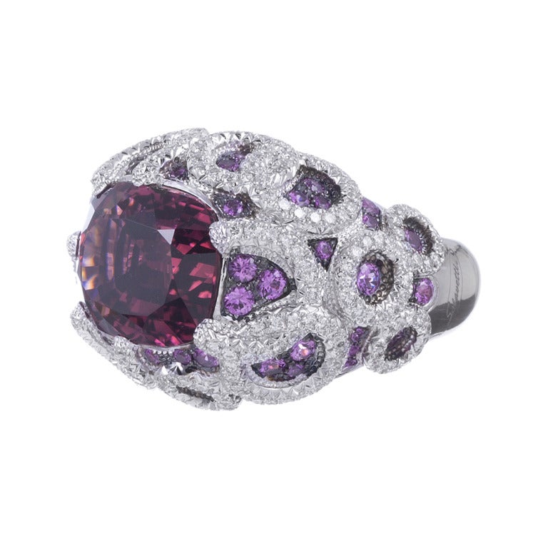 In-keeping with the designs for which Salavetti is beloved, this is a substantial ring, with bold style and physical size. The center is a large oval pink tourmaline, contained in a detailed mounting, accented with pink sapphires and white diamonds.