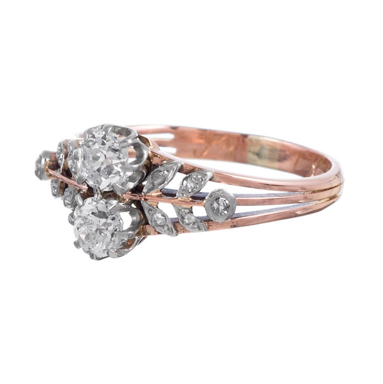 14k rose gold ring with a platinum top and a charming floral motif, decorated with diamonds. For the antique jewelry enthusiast who would like a non-traditional wedding ring or for the lover of all things one-of-a-kind, this is the ideal piece.